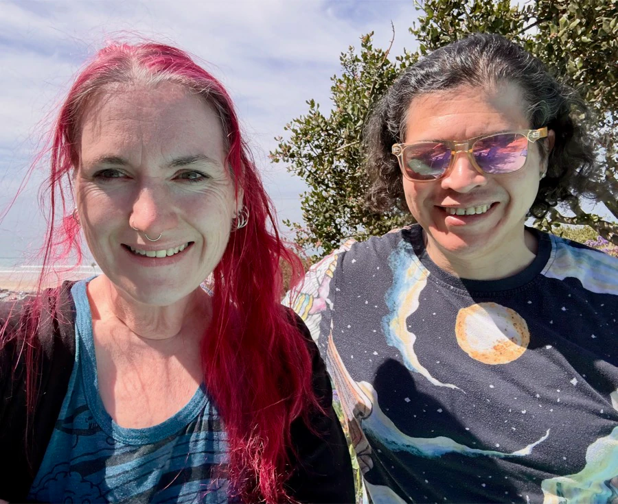 Katharyne Shelton and Isaac Gonzalez smiling together outdoors